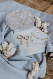  Pearl '3 in a row' hoop earrings with delicate gold-tone accents.