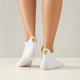 White socks with heart-shaped tongue design, available in various colors and sizes.