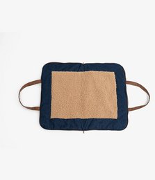 Rectangular pet basket made of denim material with a soft, beige interior lining. Features two leather handles for easy carrying.