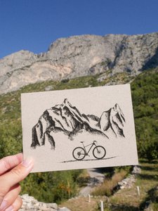 Grass paper map mountains and wheel