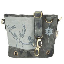 A gray canvas shoulder bag with a printed deer/edelweiss motif, featuring a vegan material, multiple straps and hardware, and a traditional design.