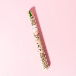 Seasoned salt in a pink and green package, containing a blend of spices for seasoning food.