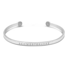 A silver or gold-colored charm bracelet with the text "SCHWESTERHERZ" engraved on it. The bracelet has a simple, minimalist design with a circular charm on each end.