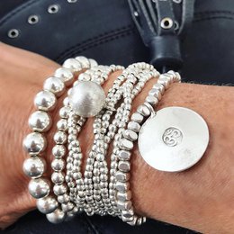 Meaningful silver bracelet with a large Om