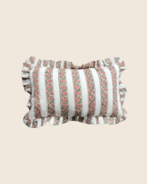  Blush pink rectangular cushion with floral and striped patterns, made of soft, plush material.