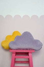 Soft, plush velvet pillow in a soothing purple color, perfect for adding a cozy touch to a baby's room. Decorative cloud-shaped accent pillow.