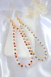 "Sparks of Love" 18K golden hearts and Austrian crystals beaded phone lanyard in light blue and red colors.