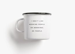 White enamel mug with text "I don't like morning people or mornings or people" printed on it.
