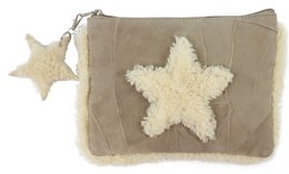 A beige leather bag with a star-shaped applique design. The bag has a zipper closure and a small star-shaped charm attached.