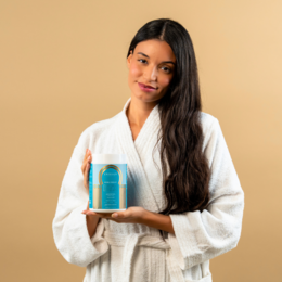 White hydrating hair mask in woman's hand, long brown hair, before and after hair treatment images.