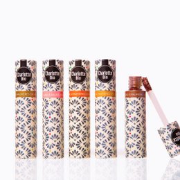 Organic liquid eyeshadow in shades of Or (gold), Rose (pink), Marron glacé (brown), Cuivre (copper), and Vert émeraude (emerald green). Creamy, blendable formula with a shimmery finish.