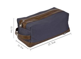  Navy blue and brown toiletry bag with zipper closure and leather accents.