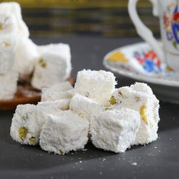 Soft, chewy gummy candies in a classic milky flavor, with a dusting of powdered sugar.