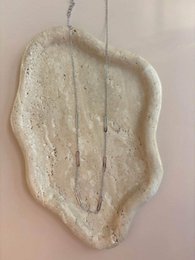  "Cream textured ceramic pendant, organic wavy shape, minimalist design chain accessory"