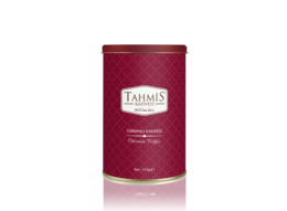 A round, tall, red tin container with the Tahmis logo and text indicating it contains Ottoman Coffee with spices.
