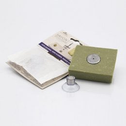 Magnetic soap holder in green color, made of durable material, suitable for bathroom storage and organization.