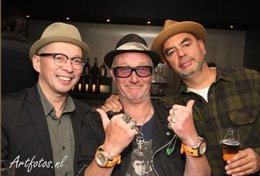 Silver-toned stainless steel watch with a large dial, black bezel, and a textured strap. The watch face features a distinctive design with a circular pattern and blue accents.