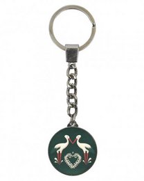 Keyring with a circular design featuring two storks in a heart-shaped pattern, representing the traditional Alsatian stork motif. Made of metal with a green enamel finish and a silver-tone chain.
