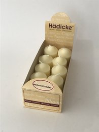 Scented votive candle in Christmas magic fragrance, set of 10 candles in a box. Cream-colored round candles with a festive holiday scent.