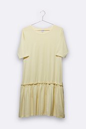 Light yellow women's dress with a drop waist and ruffle hem. Made of a soft, lightweight material. Available in sizes S, M, L.