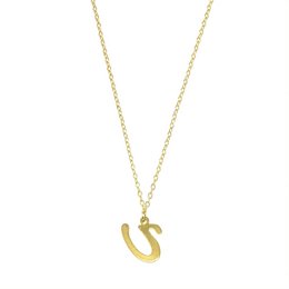 A gold-colored necklace with a pendant in the shape of the letter 'U'. The necklace appears to be made of a delicate chain and the pendant is a simple, minimalist design.