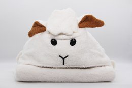 Soft, plush white bath poncho with a sheep-like design, perfect for kids' bathtime.