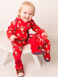 A red zip-up romper with a highland cow print, suitable for babies aged 3-24 months.