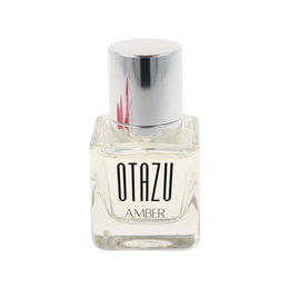 Amber-colored perfume bottle with silver cap. The perfume is called "Otazu Amber Eau de Parfum".