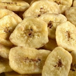 "Organic dried banana chips, golden yellow color, round flat slices, bulk 1.25kg package, natural sweetened snack"