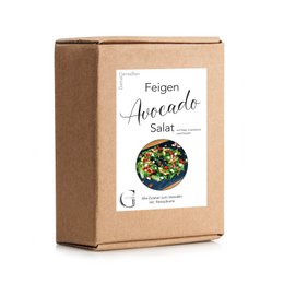  A rectangular cardboard box containing a fig and avocado salad. The box is labeled "Feigen Avocado Salat" which translates to "Fig Avocado Salad" in English.