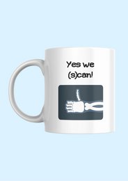 A white ceramic mug with the text "Yes, we (s)can" and an image of a hand holding a fork.