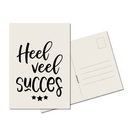 Greeting card with handwritten text "Heel veel succes" (Dutch for "Wishing you great success") in black calligraphy-style font against a plain white background. The card has a simple, minimalist design.