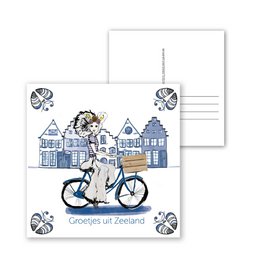 Postcard featuring a bicycle in front of traditional Delft Blue houses in Zeeland, Netherlands. The postcard is suitable for birthday celebrations.