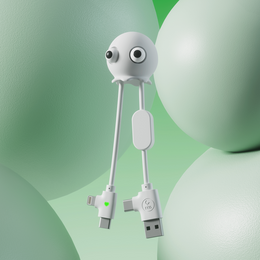  A white, jelly-like cable with large eyes and a friendly, anti-stress design, suitable for charging electronic devices.
