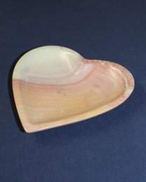 Heart-shaped natural soapstone serving bowl with a smooth, polished finish.