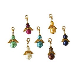 Set of 7 colorful angel-shaped keychains with various gemstones and beads, including rubies, emeralds, and pearls, creating a lucky charm design.