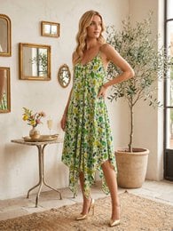 Floral print midi dress, sleeveless, green and amber botanical pattern, flowing asymmetrical hem, women's casual dress.