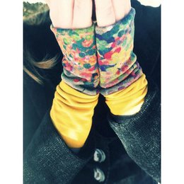 Colorful, patterned arm warmers or cuffs made of ponte jersey fabric. The description includes details about the materials, style, and patterns visible in the images, such as floral, abstract, and animal prints. This information could be useful for a semantic search to find similar products.