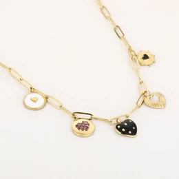  Gold-toned necklace with various charms including a heart, circle, and polka dot shapes.