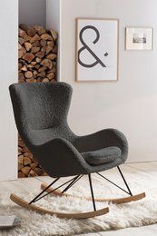 Comfortable grey rocking chair with soft teddy fur upholstery and wooden rocking base.