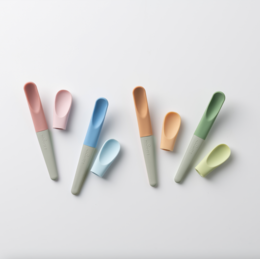  Colorful, ergonomic kids cutlery set in blue, green, pink, and yellow tones. Includes spoons and forks of various shapes and sizes suitable for young children.