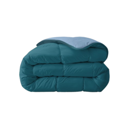 Plush, oversized duvet in a rich teal color with a soft, cozy texture. Ideal for creating a relaxing, comfortable bedroom environment.