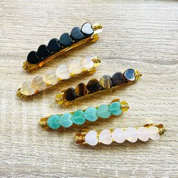 Elegant hair clips with natural stones in various colors including onyx noir, agate grise, oeil de tigre, aventurine verte, and quartz rose. Stylish and versatile accessory for any hair type.
