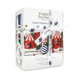 Holiday-themed tea gift set with 12 tea pyramids in a festive box design featuring circus-inspired illustrations.