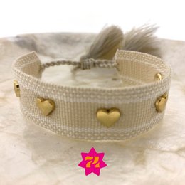  Woven bracelet with gold-colored heart charms, suitable for casual or formal wear.