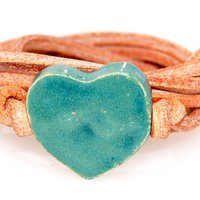 Natural leather bracelet with green heart