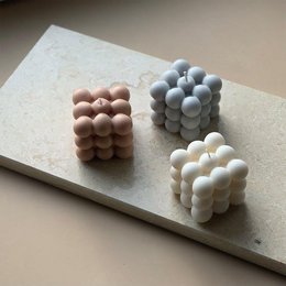 Set of 3 cream, light gray, and beige bubble candles

The image shows a set of 3 bubble candles in different colors - cream, light gray, and beige. The candles have a unique bubble-like texture and shape, creating an interesting visual effect. These candles would be suitable for use in home decor or as part of a festive display.