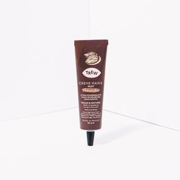 A 100% natural, vegan, and fragrance-free night hand cream in a dispenser packaging. The cream is made with natural ingredients and is suitable for sensitive skin.