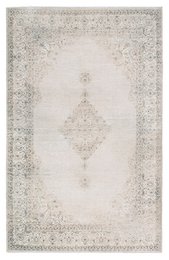  A large, vintage-style area rug with a modern, short pile. The rug features a neutral sand color and a detailed, intricate pattern. It is machine washable for easy care.
