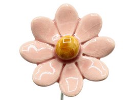 A small, pink ceramic daisy flower with a yellow center, measuring approximately 3.5 cm in size. The flower is made of ceramic material and is suitable for use as an artificial plant or decoration.